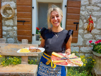 Anna with alpine dishes