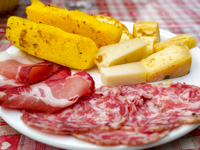 Inviting dish with polenta, cheese and cold cuts