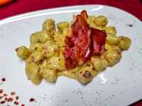 Gnocchi with 4 cheeses and chopped speck