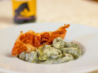 Nettle gnocchi with Asiago fondue and crispy speck