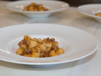 Homemade potato dumplings with meat sauce