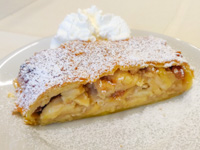 Apple strudel with whipped cream