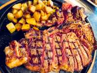 Grilled rib with baked potatoes
