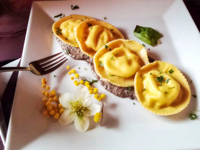 Ravioli stuffed with porcini mushrooms on truffle sauce