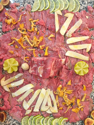 Raw meat dish with fresh mushrooms