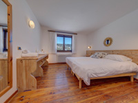 Double room with wooden furniture