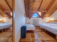 Triple room with exposed wooden beams