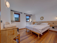 View of the double room of the Malga Campomulo Refuge