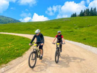 The bikes of the E-bike rental of the Valmaron Refuge on dirt road