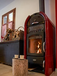 The characteristic stove of the bar of the Alpine Refuge