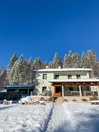 The Alpine Refuge bar in the embrace of the snow