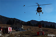 Firefighters and helicopters into action to put out the fire of Asiago