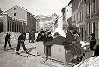 In the Centre of Asiago on skis pulled by sled